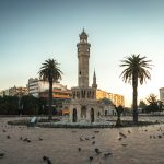 a large clock tower towering over a city