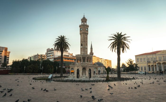 a large clock tower towering over a city