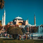 people walking near fountain during daytime