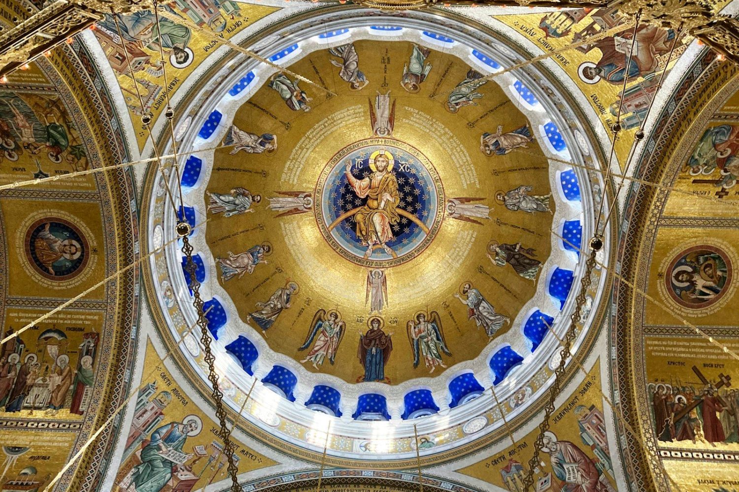 the ceiling of a church with paintings on it