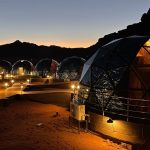 a group of domes lit up at night
