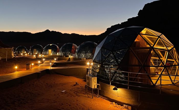 a group of domes lit up at night