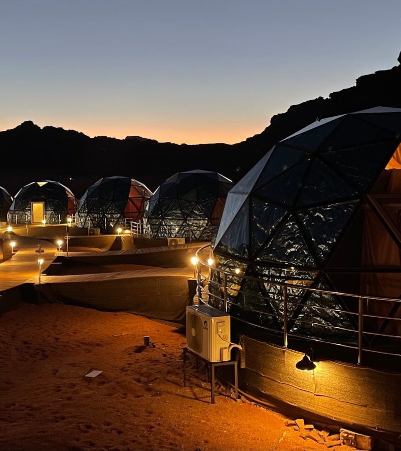 a group of domes lit up at night