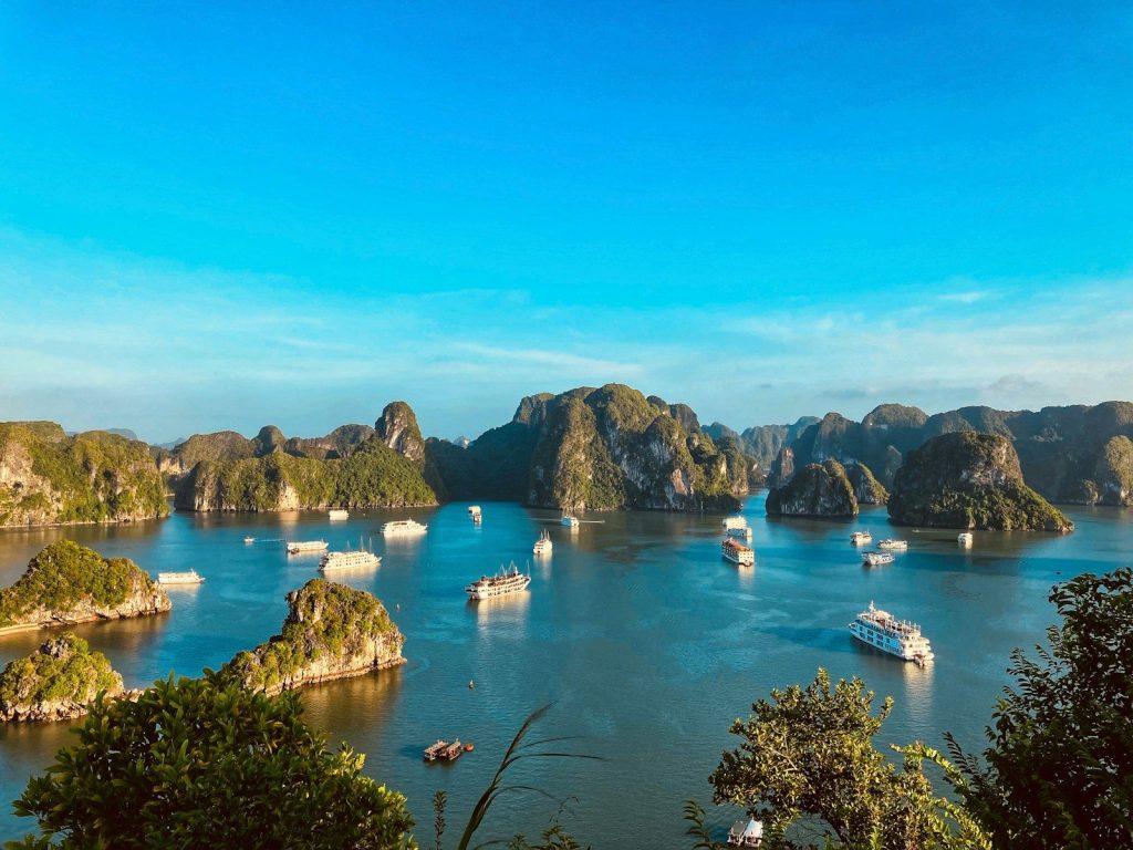a group of boats floating on top of a large body of water